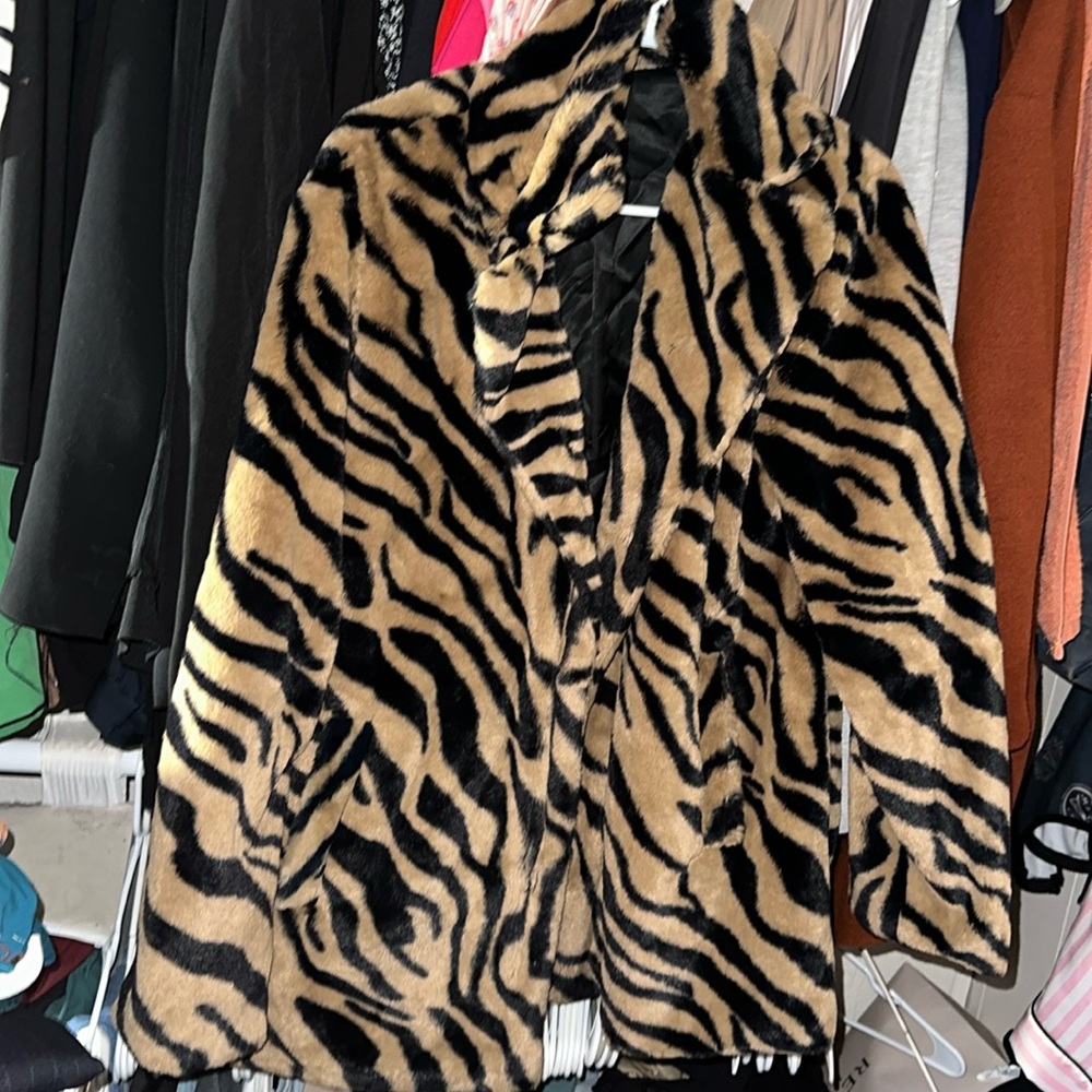 Medium, below the hip, in great condition worn twice.
